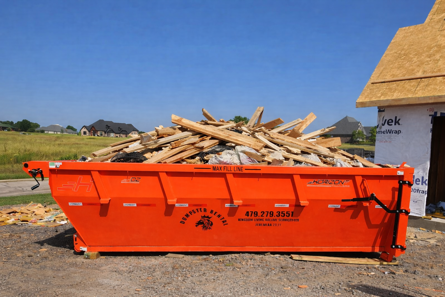 Overfilled dumpster with debris above the rim — not allowed — Kingdom Living Rolloff Services